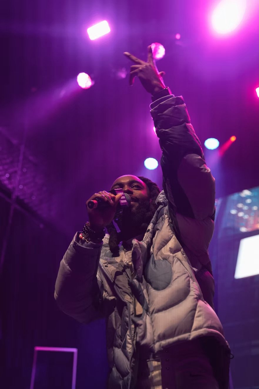 A performer under purple light