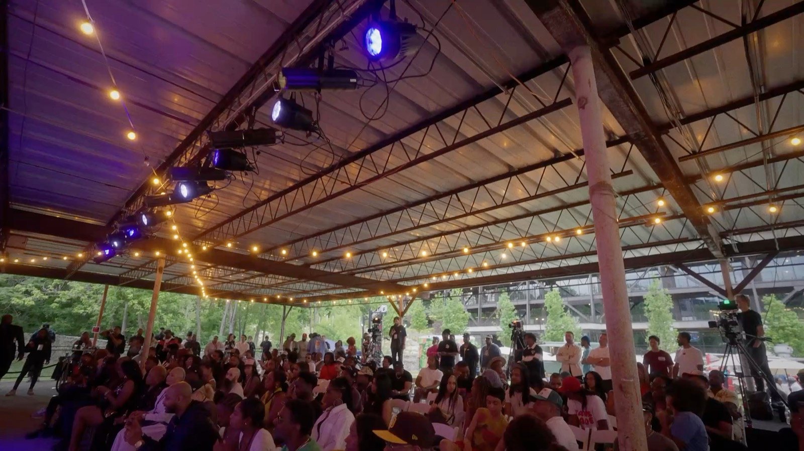 The crowd, under the string lights
