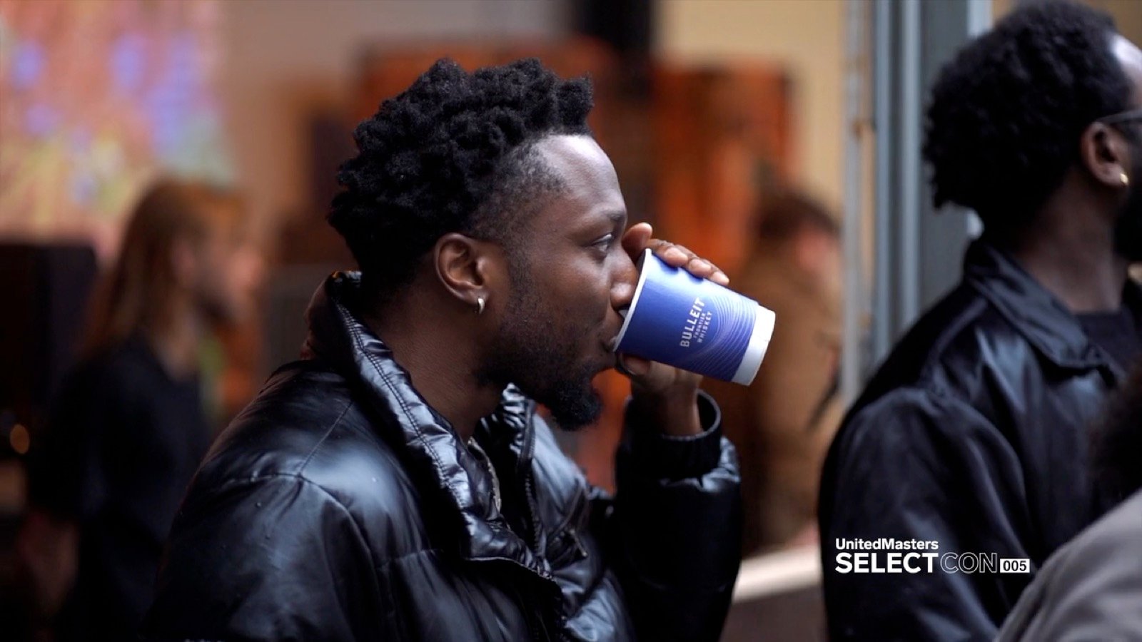 An attendee with a Bulleit pour